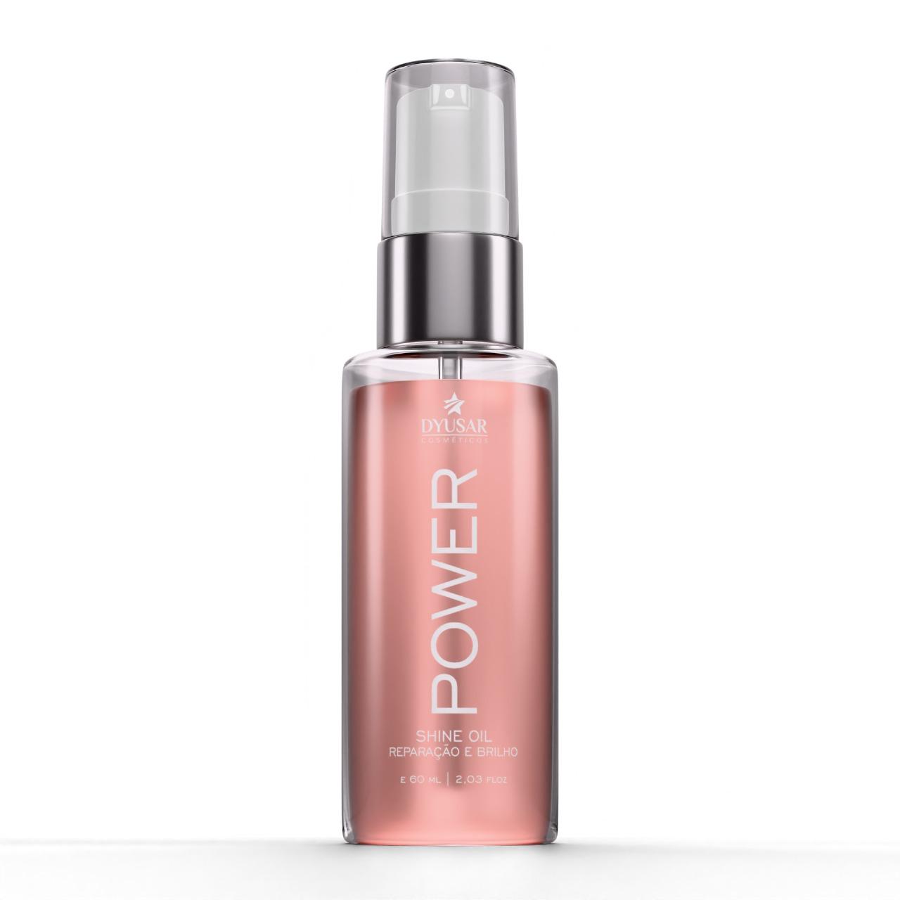 Frasco de 60ml do Óleo de Argan Reparador de Pontas Dyusar Power Shine Oil, na cor rosa, com válvula spray, em fundo branco